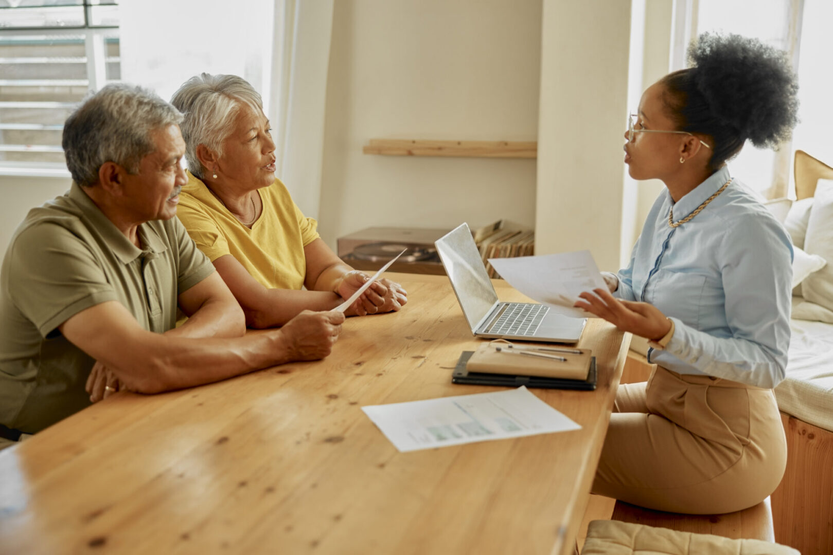 Elderly couple consulting with advisor